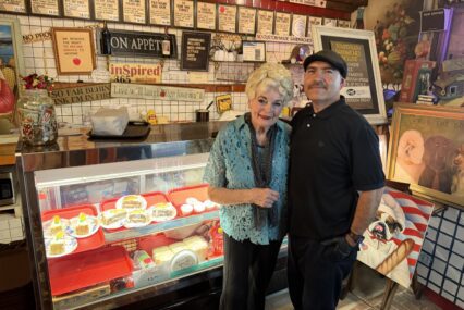 A woman and man standing inside a sandwich shop in San Jose, California