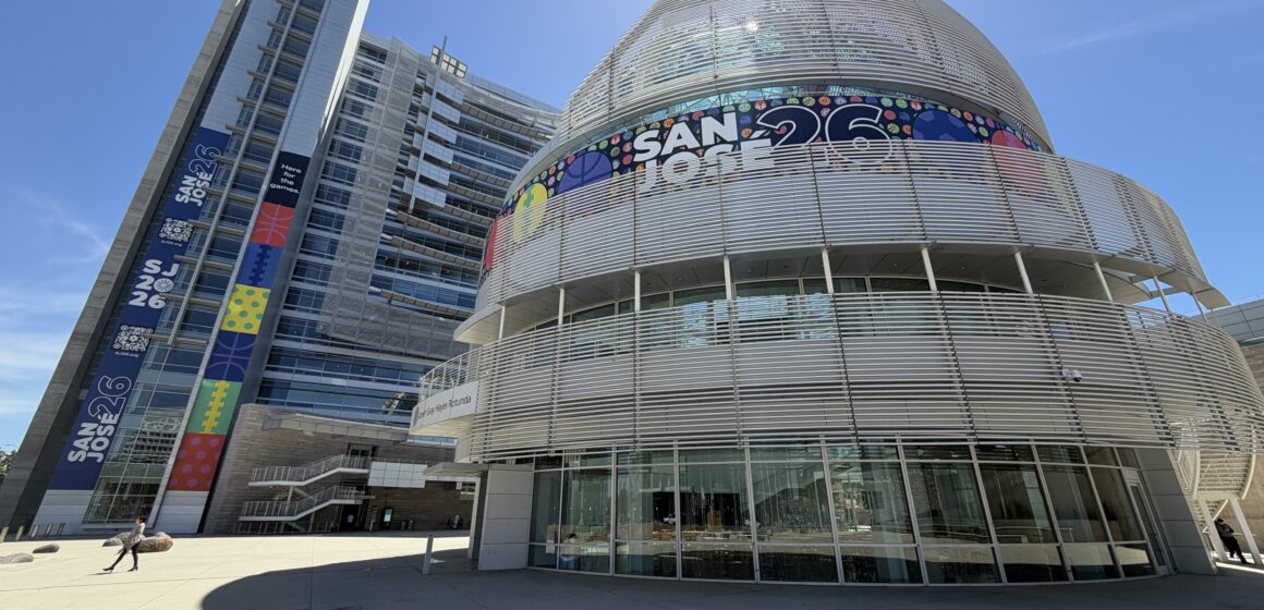 A women walks in front of a large government building in San Jose, California