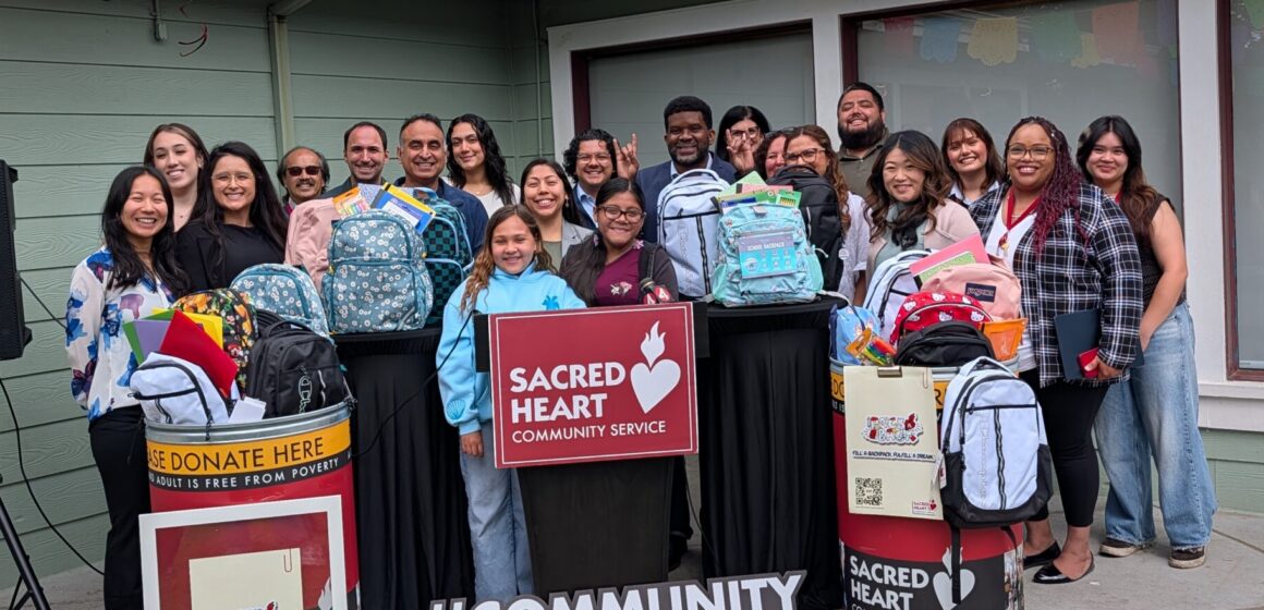 STUDENTS NEED SUPPLIES A group of people standing with backpacks full of school supplies to give to students in need