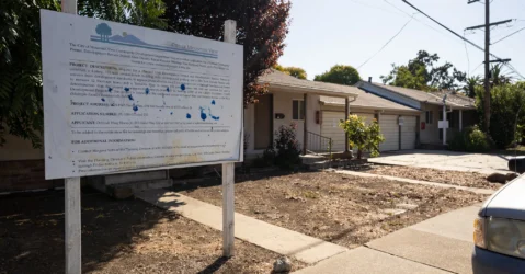 A development project sign in front of a home in Mountain View, California