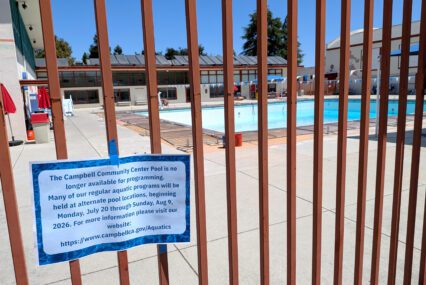 A closed community pool behind a fence in Campbell, California