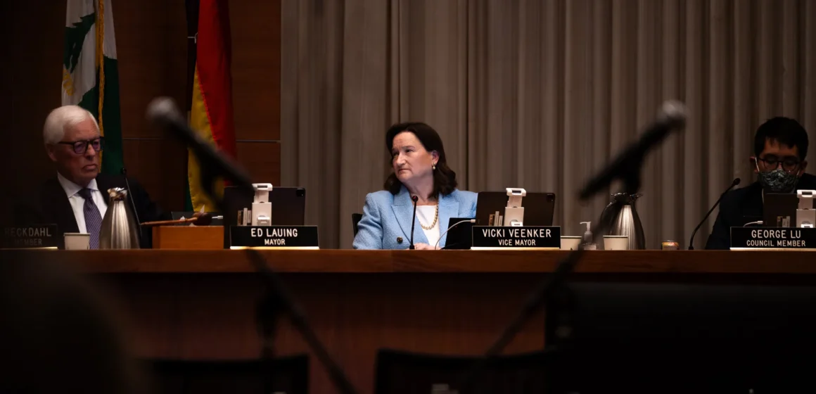 Palo Alto Vicki Veenker Embarcadero A woman sitting behind a dais at a government meeting in Palo Alto, California