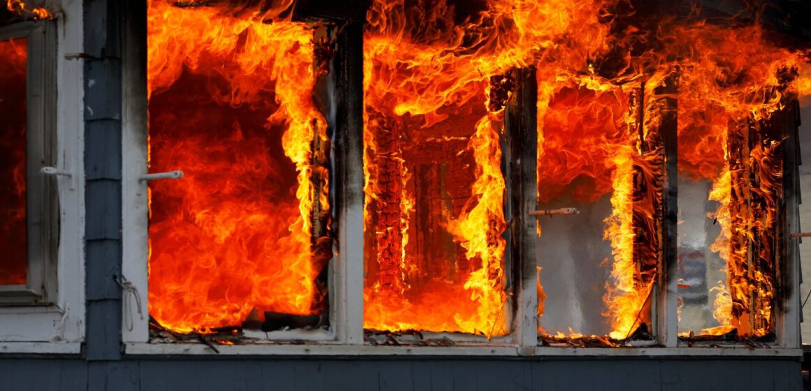 Fire collins column Fire burning through windows of a home