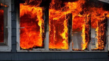 Fire collins column Fire burning through windows of a home