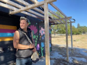 A formerly homeless person standing outside in San Jose, California