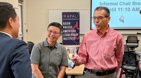 Three Asian men speaking at an event in Santa Clara, California