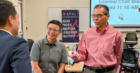 Three Asian men speaking at an event in Santa Clara, California