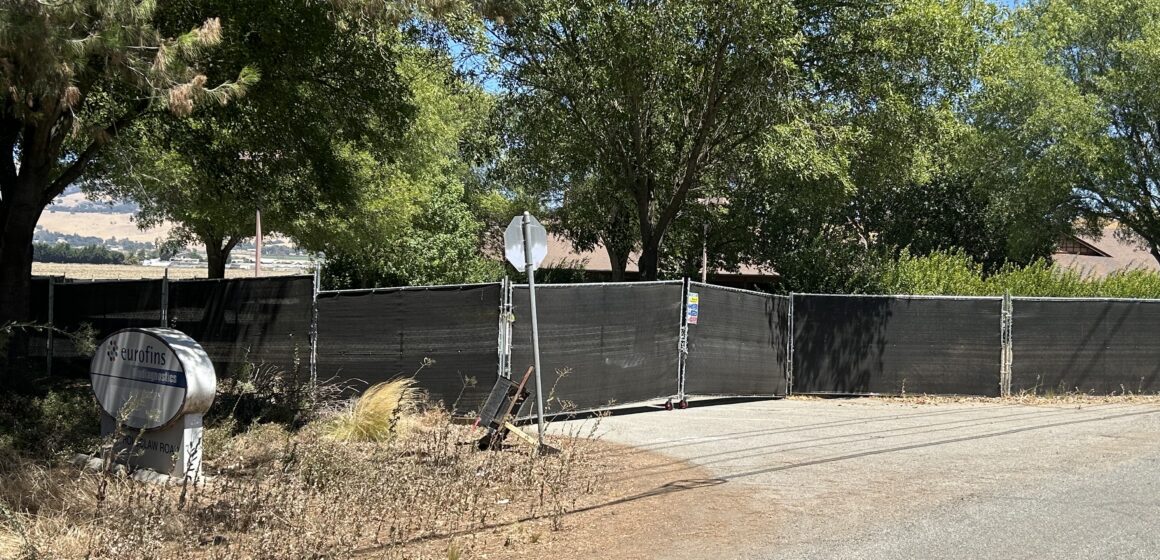 ICE Facility-4- near Gilroy 7-27-26 A fence blocking the entrance to a property just outside of Gilroy, California