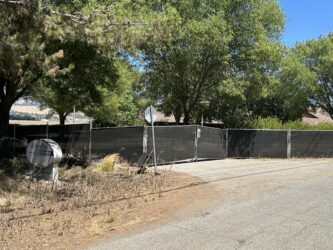 A fence blocking the entrance to a property just outside of Gilroy, California
