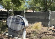 A sign and fencing outside of a former agricultural facility near Gilroy, California