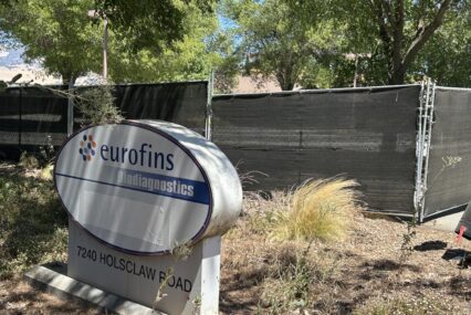 A sign and fencing outside of a former agricultural facility near Gilroy, California