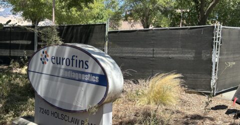 A sign and fencing outside of a former agricultural facility near Gilroy, California