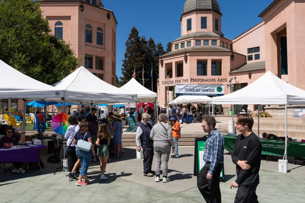 People walking in front of pop-up booths in Mountain View, California