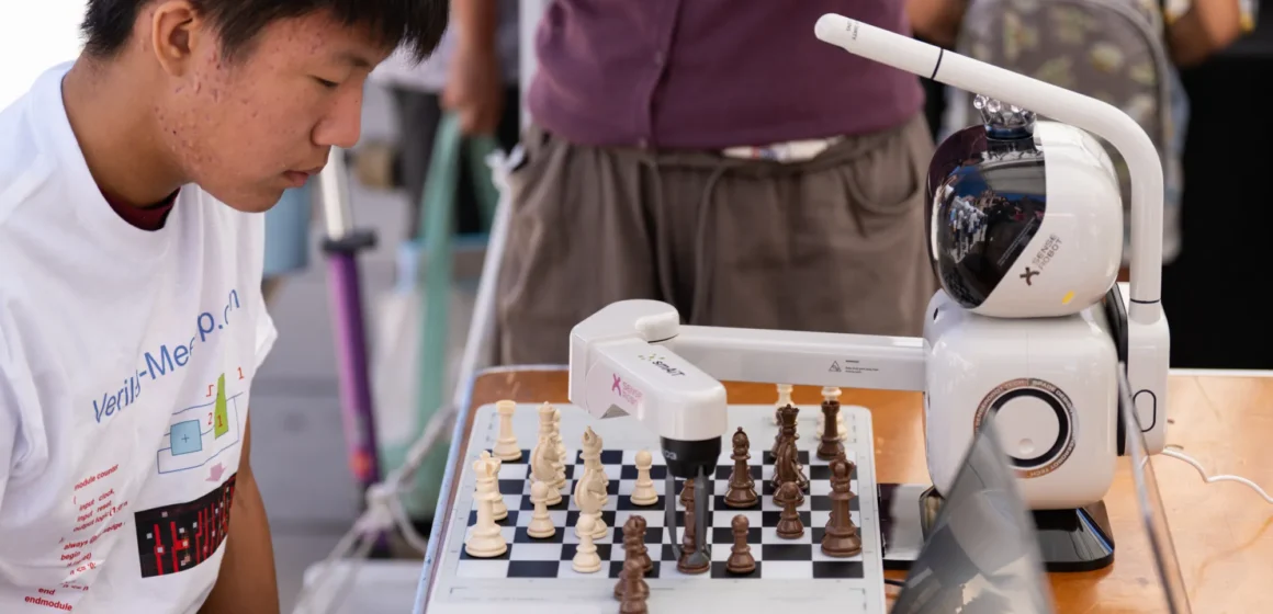 Mountain View tech showcase Embarcadero A high school student playing chess with a robot at a tech showcase in Mountain View, California