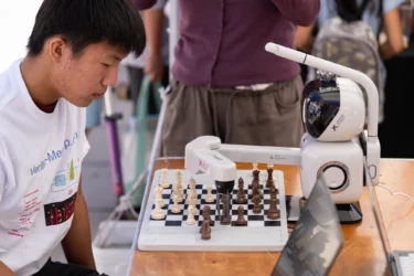 Mountain View tech showcase Embarcadero A high school student playing chess with a robot at a tech showcase in Mountain View, California
