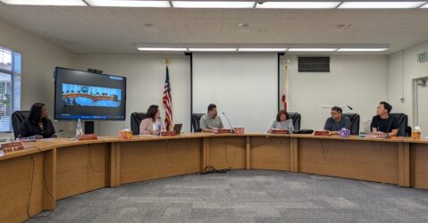 People sitting at a dais at a school board meeting in San Jose, California