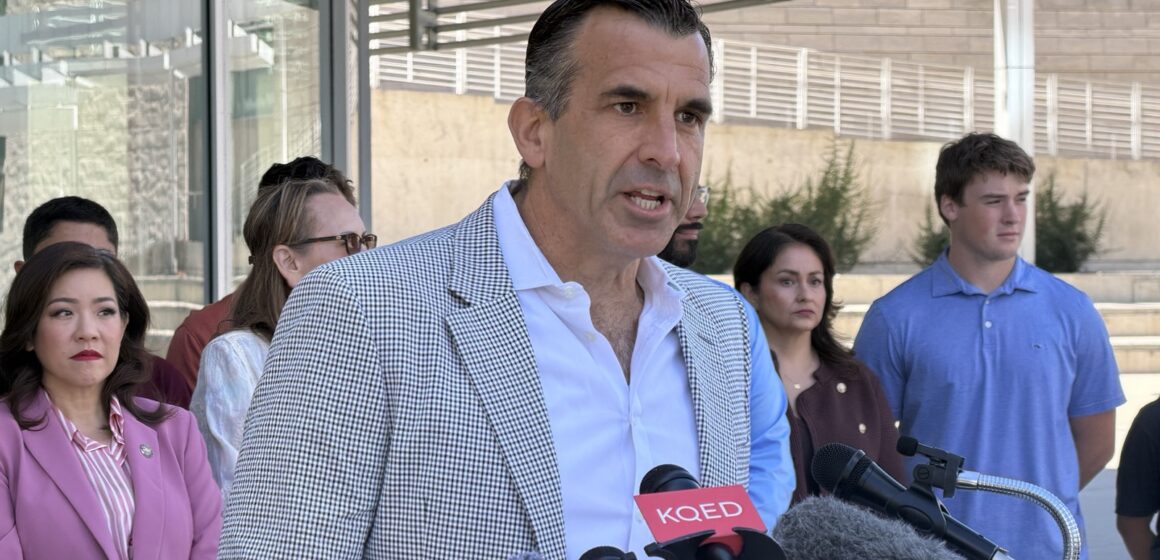 Rep. Sam Liccardo A man speaks at a podium.