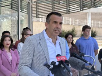 Rep. Sam Liccardo A man speaks at a podium.