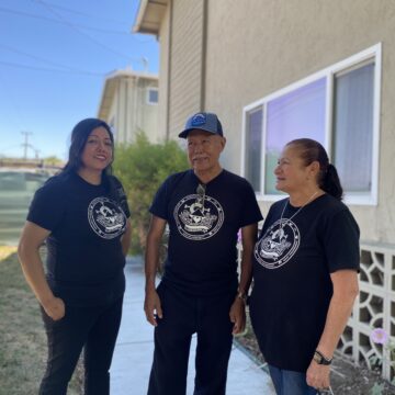 South Bay Community Land Trust The Virginian Apartments San Jose Three people standing in front of an apartment complex in San Jose, California