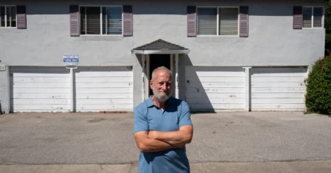 A man standing outside an apartment building in Mountain View, California