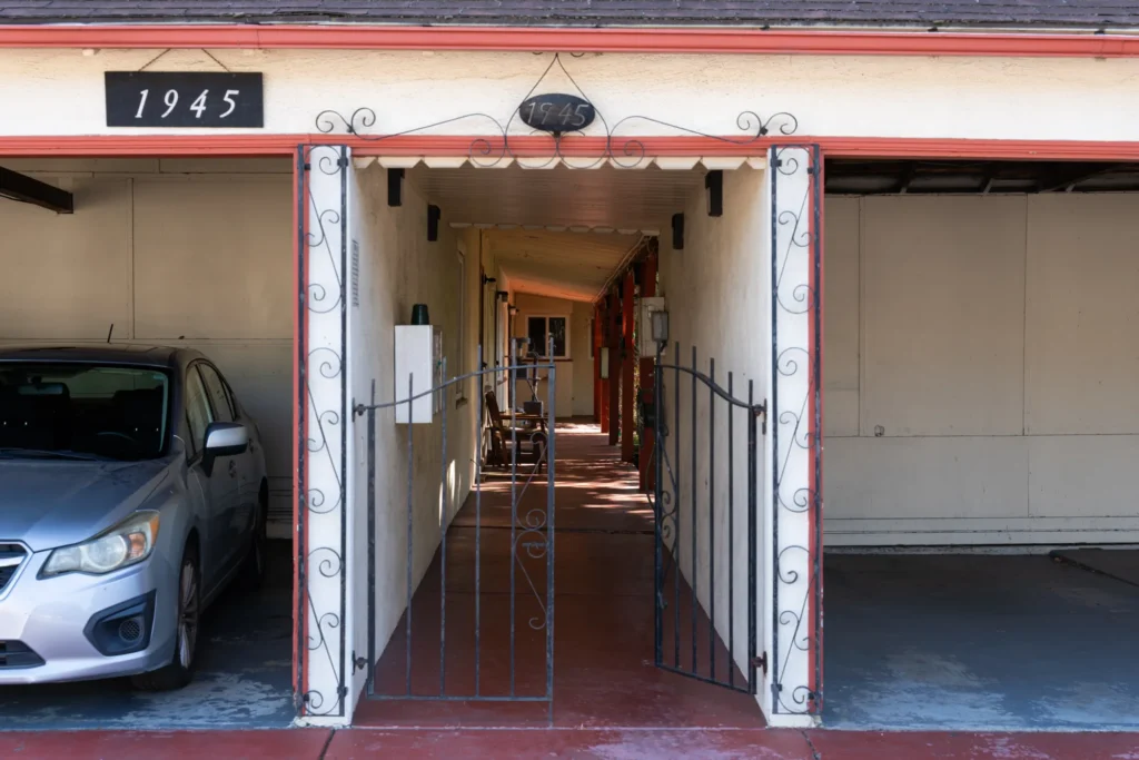 Carports and a gate leading inside an apartment complex in Mountain View, California