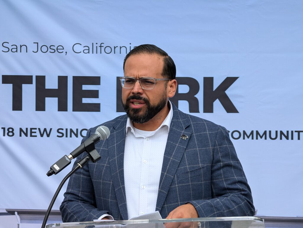 A man speaking into a microphone at a podium in San Jose, California