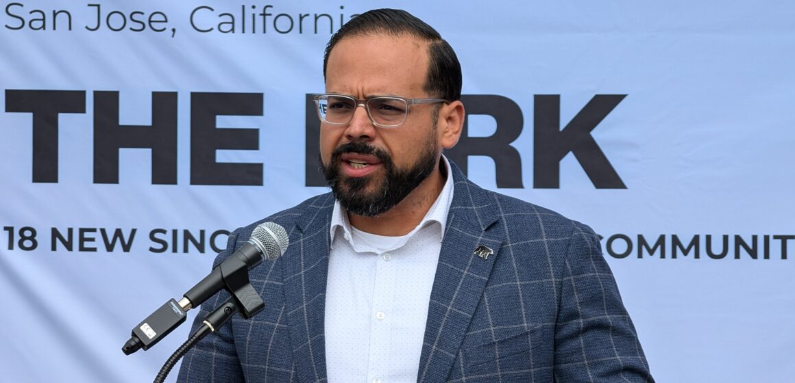 A man speaking into a microphone at a podium in San Jose, California