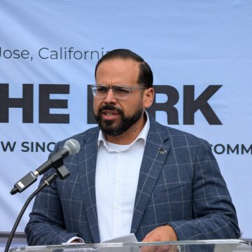 THE KIRK A man speaking into a microphone at a podium in San Jose, California