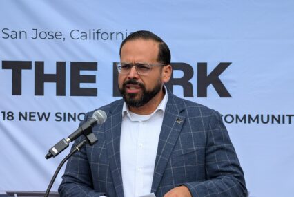 A man speaking into a microphone at a podium in San Jose, California