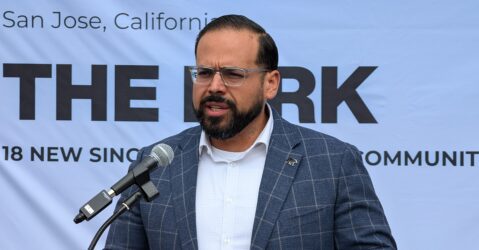 A man speaking into a microphone at a podium in San Jose, California