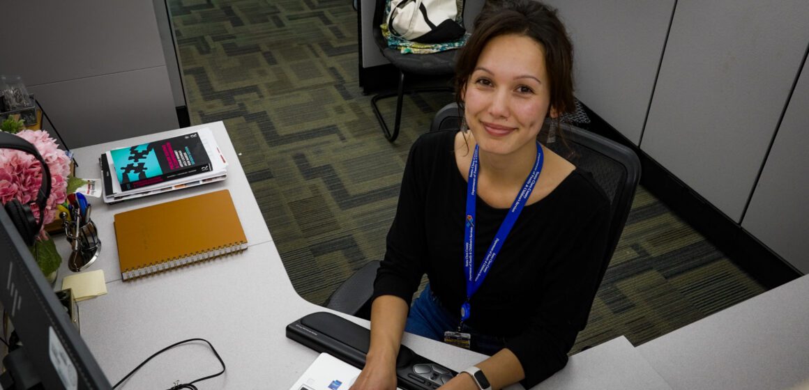 COUNTY INTERN PROGRAM A woman sitting at a desk with a keyboard