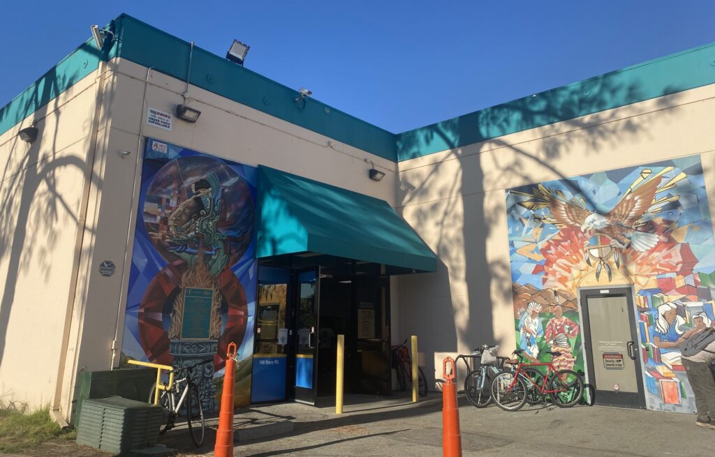 Two murals on the exterior of a building in San Jose, California