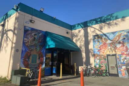 Two murals on the exterior of a building in San Jose, California