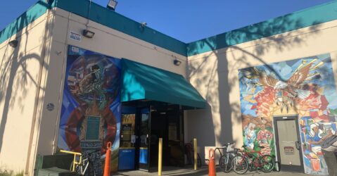 Two murals on the exterior of a building in San Jose, California