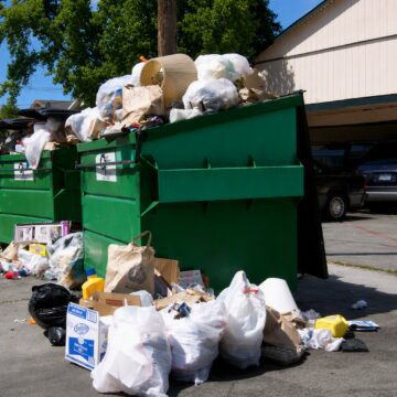 A dumpster overflowing with trash in San Jose, California