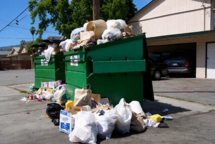 A dumpster overflowing with trash in San Jose, California