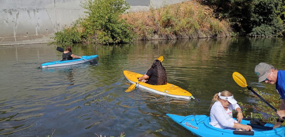 People in kayaks floating on a river in San Jose, California