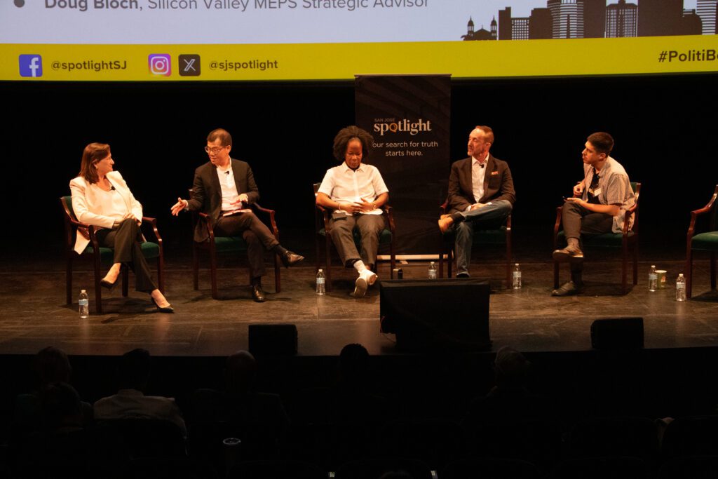 People sitting in chairs on a stage