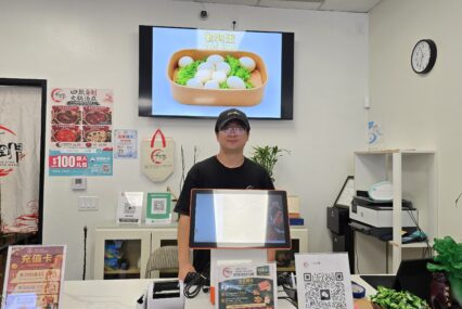 A man behind a counter at a market in San Jose, California