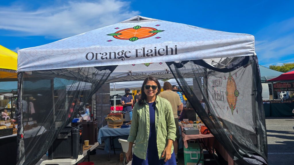 A woman standing in front of a food pop-up tent in Cupertino, California