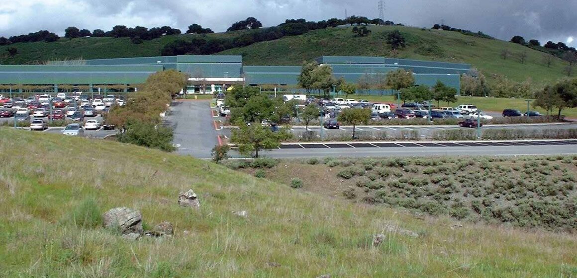 IBM REZONING A grass hil in front of a parking lot in San Jose, California