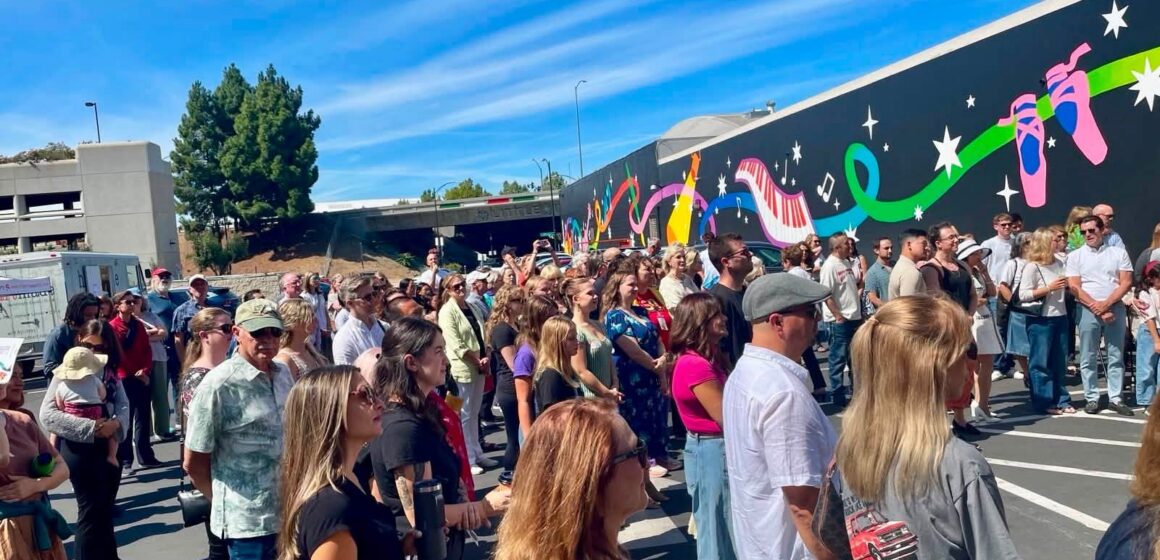 A crowd of people at a ribbon cutting in San Jose, California