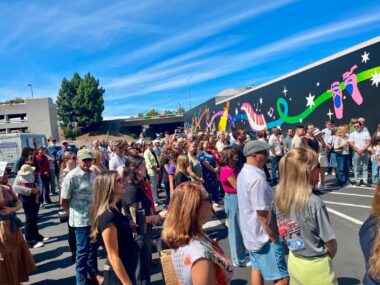 A crowd of people at a ribbon cutting in San Jose, California