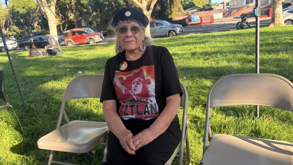 A woman with a black beret sitting in a chair in San Jose, California
