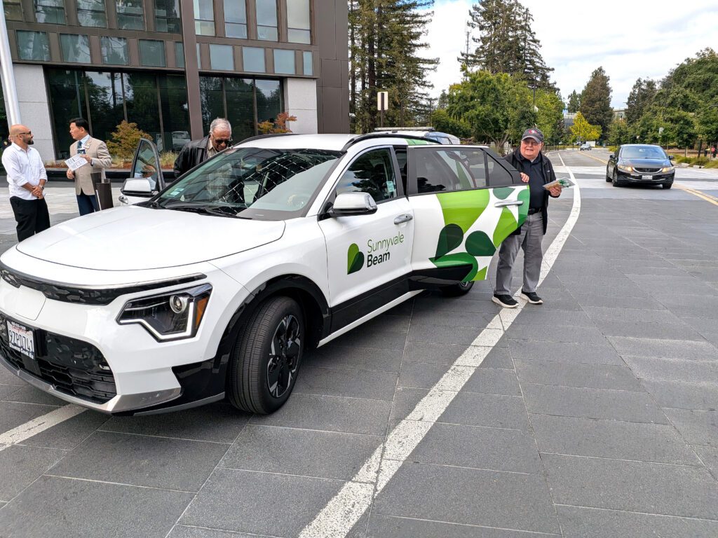 A person exits a ride-hailing vehicle in Sunnyvale, California