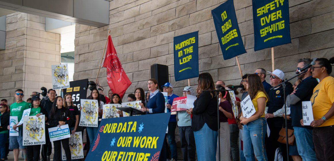 People's Tech Coalition launch A group of people with signs rallying in front of city hall in San Jose, California
