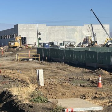 GILROY DATA CENTER Amazon data center construction sight in Gilroy with construction trucks and a crane.