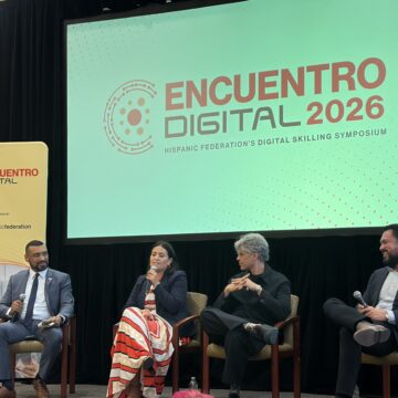 A row of people sitting in chairs at a conference in San Jose, California