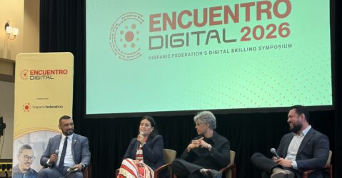 A row of people sitting in chairs at a conference in San Jose, California