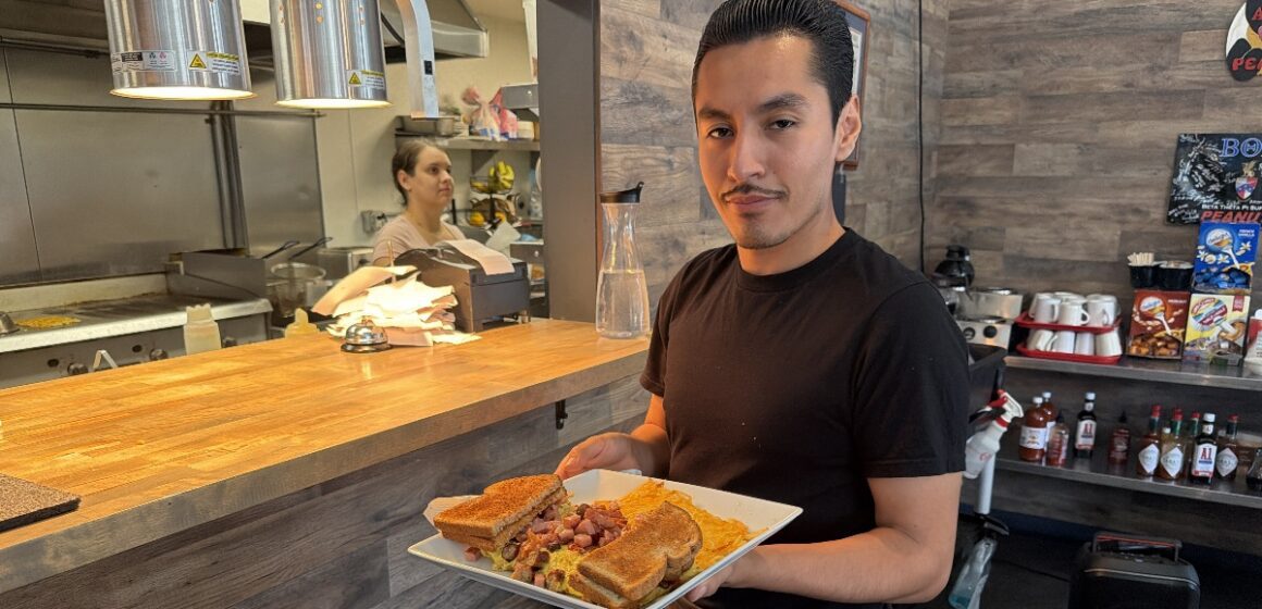 Peanuts - Christian Contreras A man holding food on a plate in a restaurant in San Jose, California